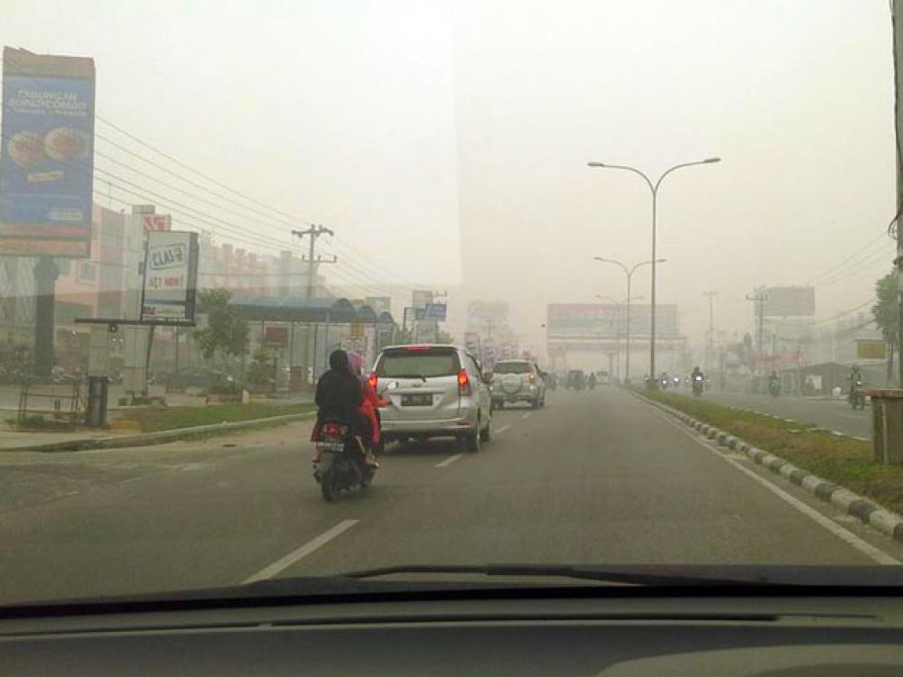 kabut asap palembang penyebab kabut asap